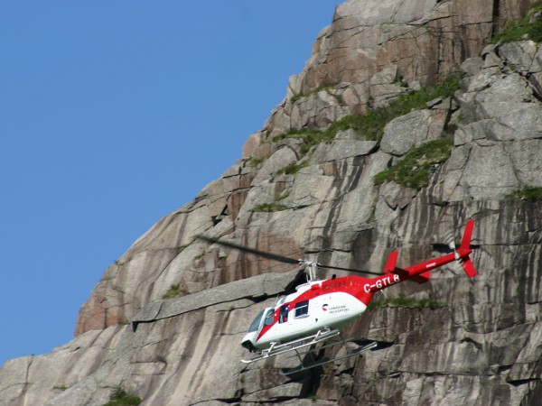 Medical personnel arrive by helicopter for their weekly visit